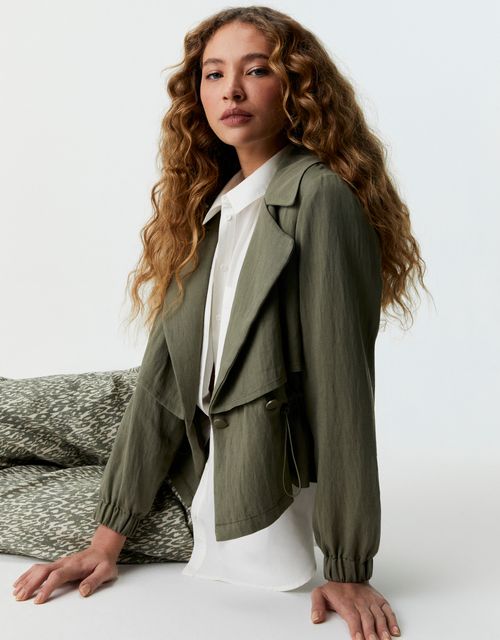 Adjustable waist trench